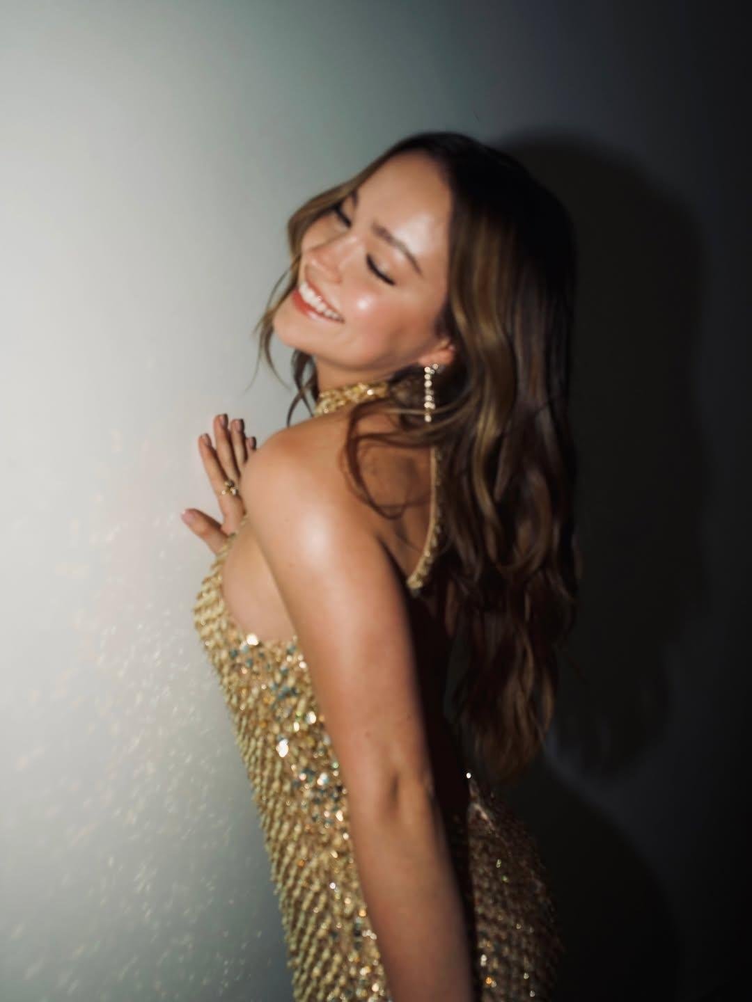 Sadie Stanley wearing Double Ruby Wrapped Heart Ring and Cascade Earrings